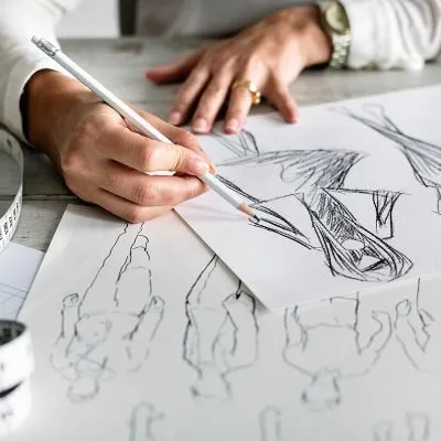 Hand sketching fashion drawings with a pencil